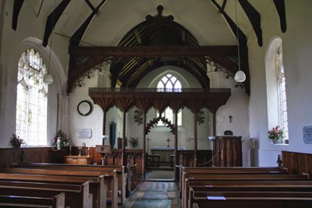 the aisle showing the pews and rood screen