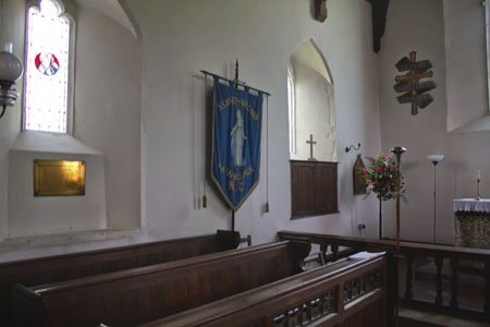 two windows, Saint Mary's Banner and some pews