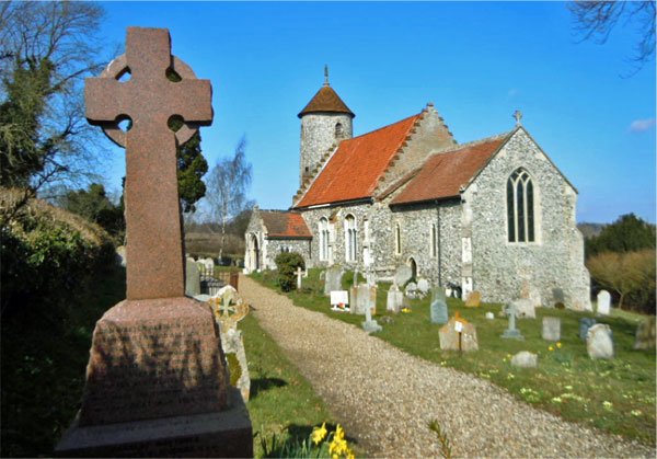 Bawburgh War Memorial with the church in the background