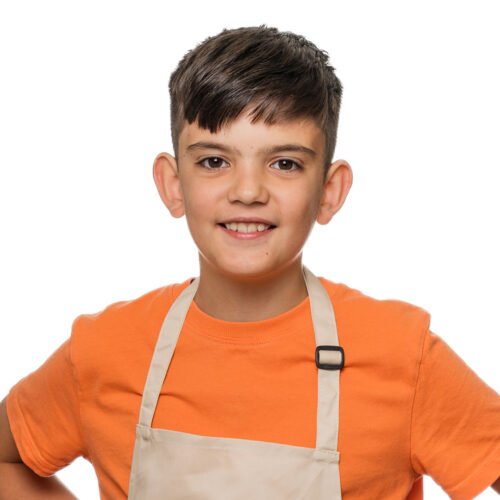 Joey in an orange t-shirt and baker's apron